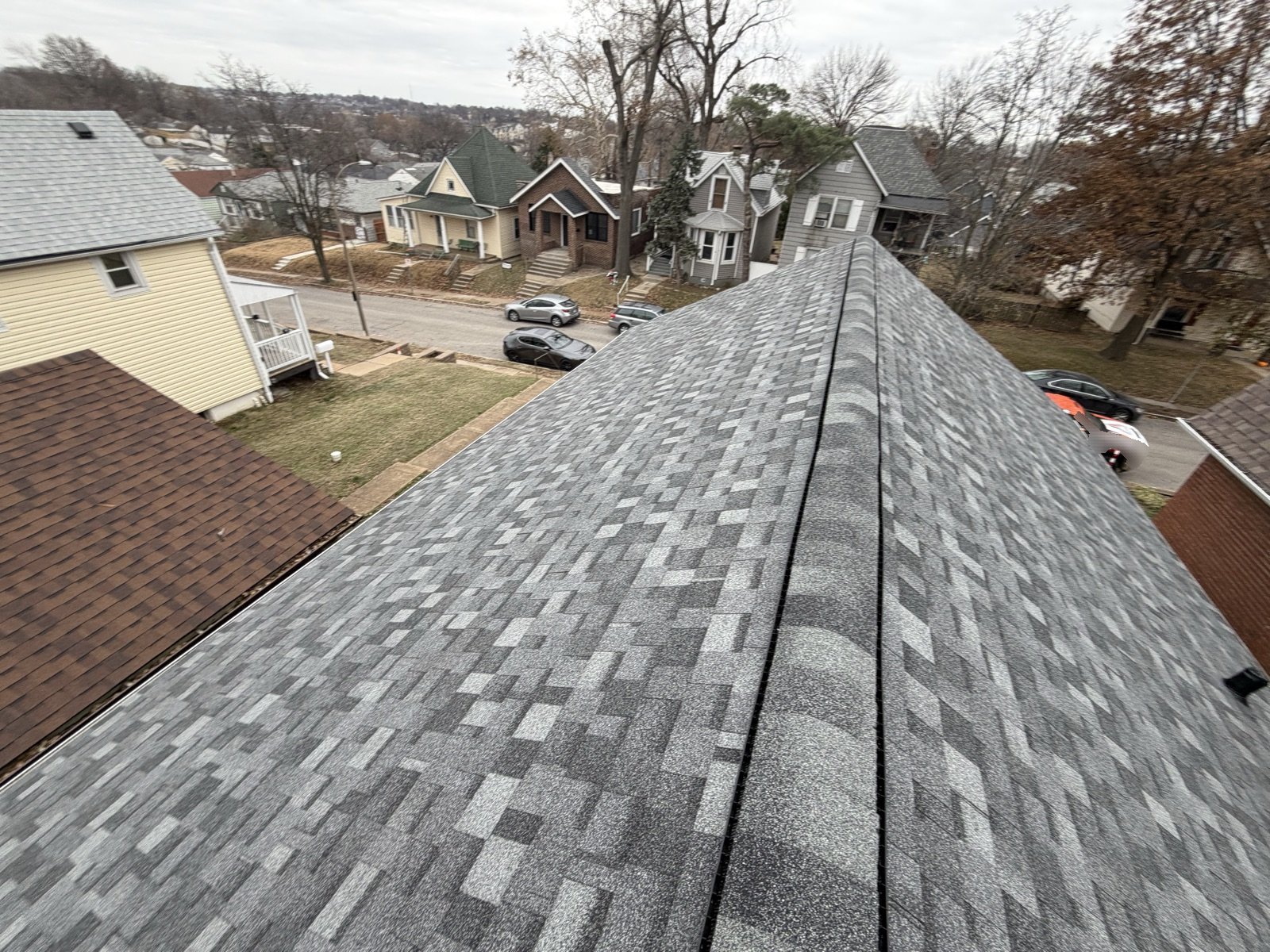 Wide view of a completed shingle roof on a St. Louis area home