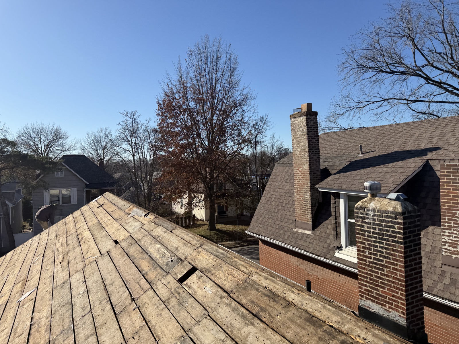 Roof tear-off with blue sky