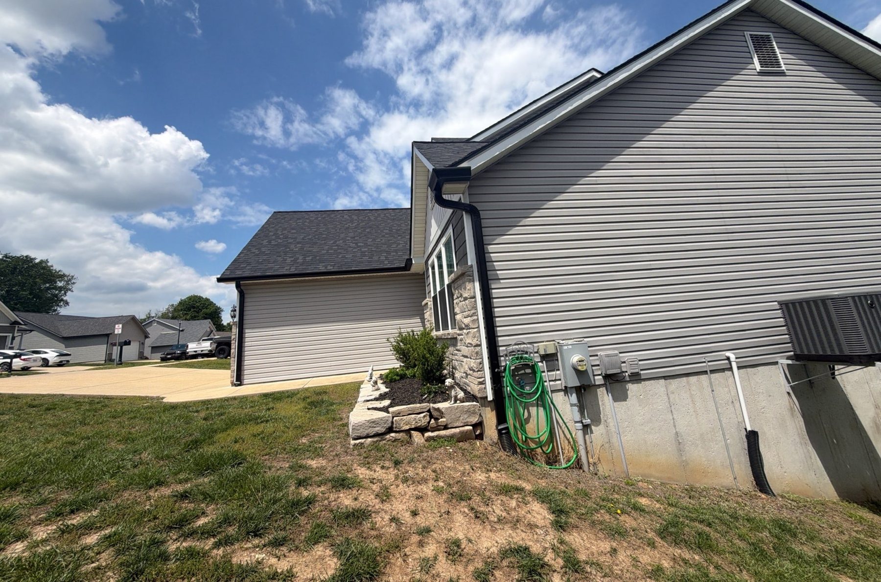New downspout on a Keys Roofing gutter job