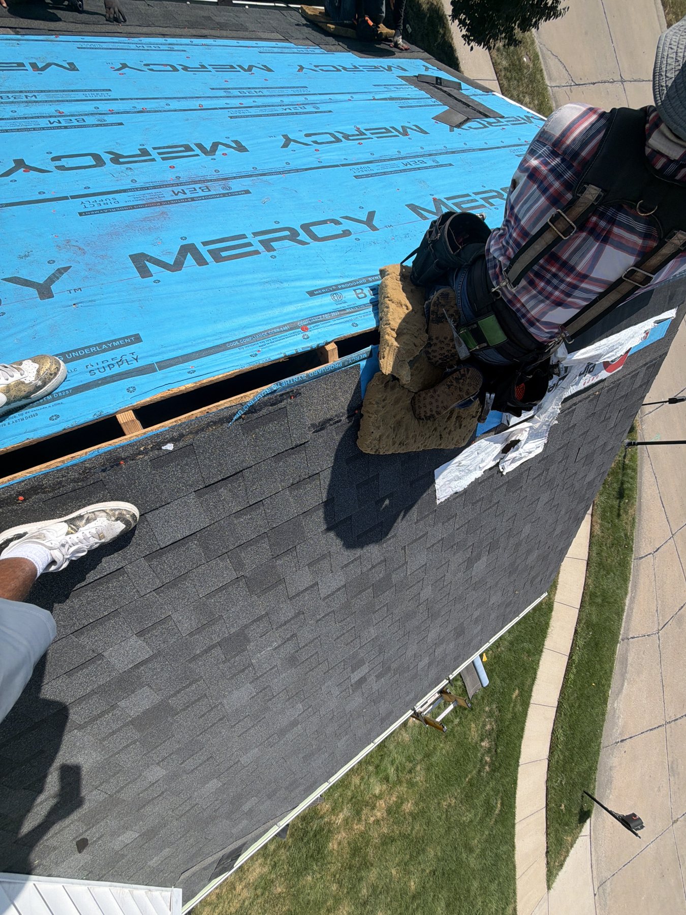New shingles going on over fresh underlayment
