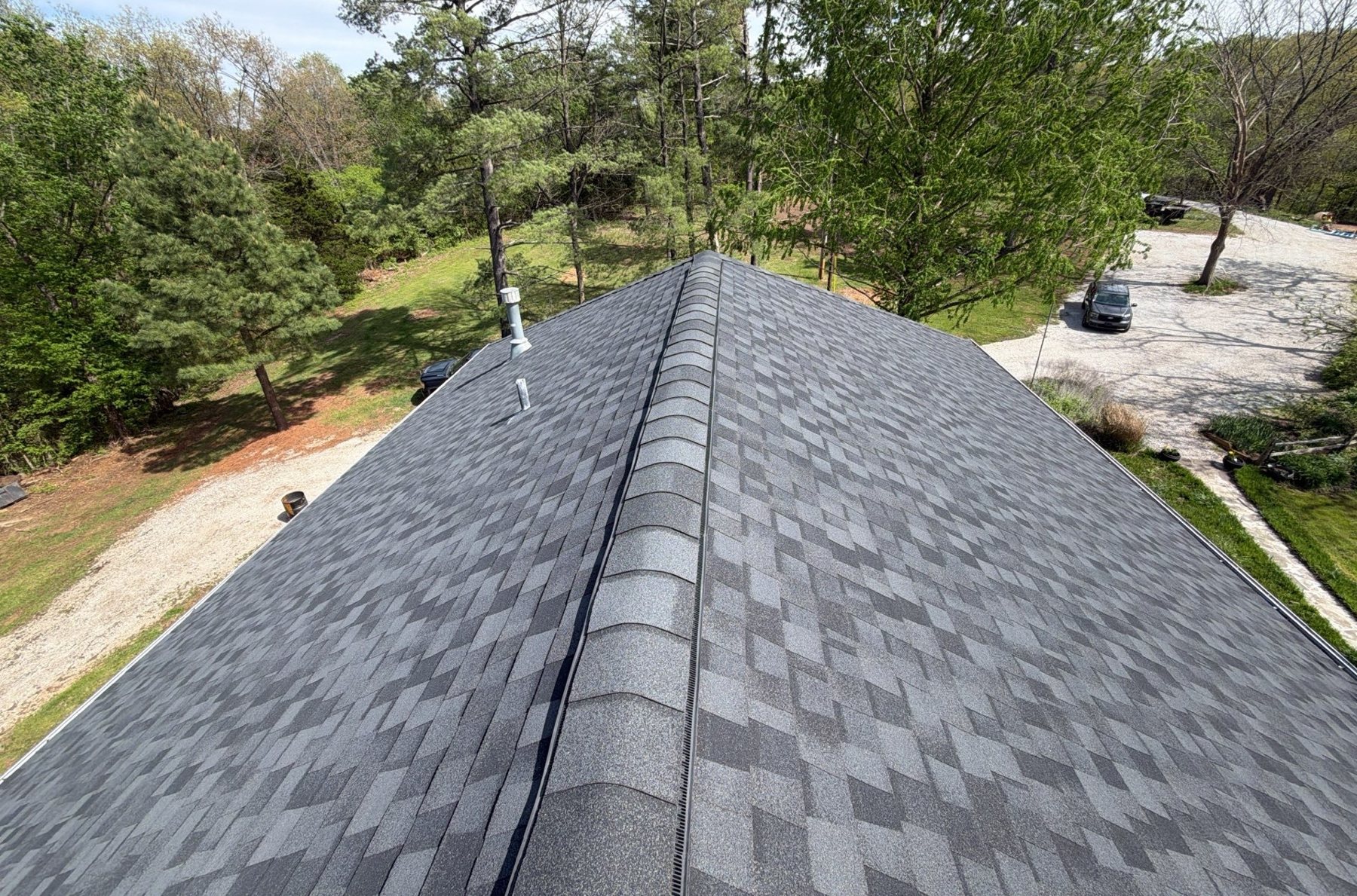Clean ridge vent and ridge cap on a completed roof